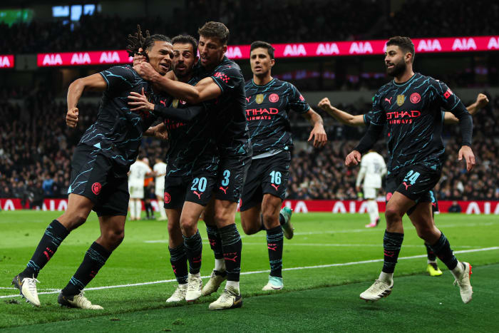 Manchester City's players pictured celebrating after a late goal scored by Nathan Ake (left) earned a 1-0 win at Tottenham Hotspur in the FA Cup in January 2024